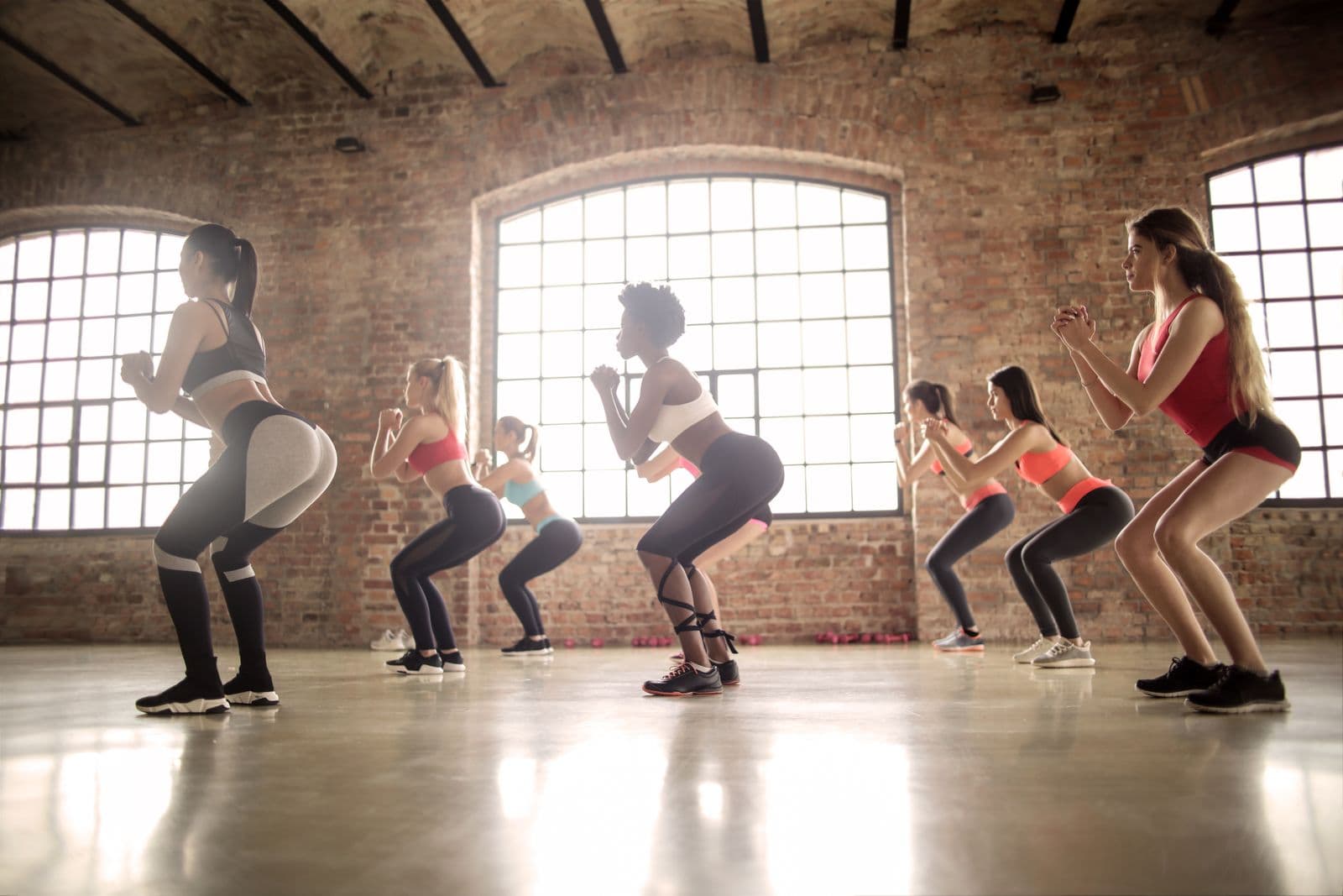 An instructor leading an in-person group fitness class